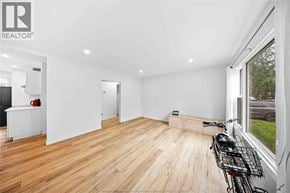 Windsor apartment for rent - A room with wooden floors and white walls, with a bicycle leaning against the wall.