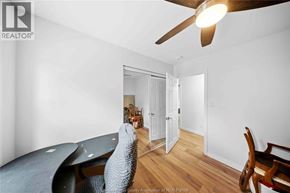 Windsor apartment for rent - A room with a ceiling fan and a bed.