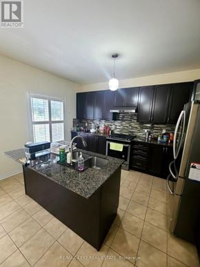 Pickering (Duffin Heights) apartment for rent - A kitchen with granite countertops and black cabinets.