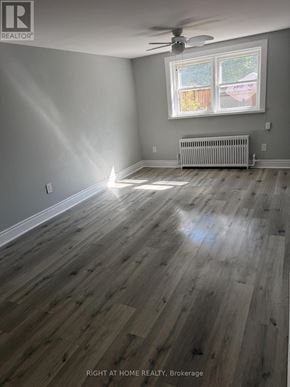 Toronto (Caledonia-Fairbank) multi-family for rent - A room with a window and a radiator on the floor.