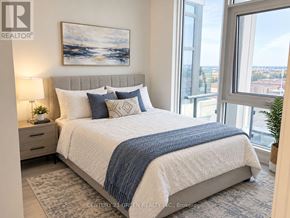 Vaughan (Vaughan Corporate Centre) condo for rent - A bedroom with a large bed and a view of the city.