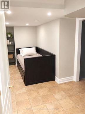 Vaughan (Vellore Village) apartment for rent - A bedroom with a black bed and a white pillow.