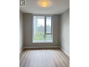 Burnaby apartment for rent - A room with a large window and wooden flooring.