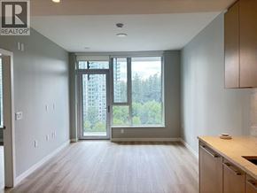 Burnaby apartment for rent - A spacious room with a sliding glass door leading to a balcony.