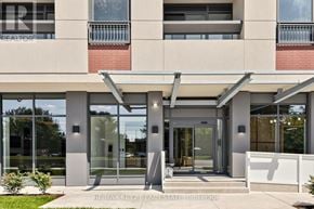 Toronto (Humber Heights) condo for rent - The image shows a modern building entrance with glass doors and a covered walkway.