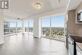 Toronto (Humber Heights) condo for rent - A spacious living room with a view of the cityscape outside the large windows.