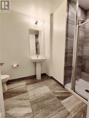 Toronto (Downsview-Roding-Cfb) townhouse for rent - A bathroom with a sink, toilet and shower.