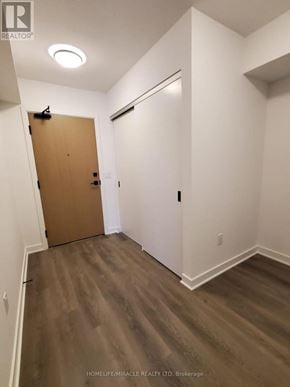 Toronto (Islington-City Centre West) condo for rent - A room with a brown door and white walls.