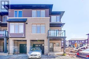Hamilton (Parkview) townhouse for rent - A two-story building with a balcony and a car parked in front.