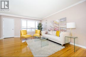 Toronto (Black Creek) apartment for rent - A living room with a white couch, yellow chairs, and a glass coffee table.
