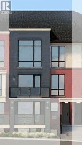 Brampton (Northwest Brampton) townhouse for rent - A modern building with a black facade and large windows.