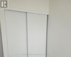 Milton (Om Old Milton) condo for rent - A white sliding door in a room.