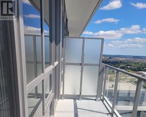 Milton (Om Old Milton) condo for rent - A balcony with glass railings and a view of the city.