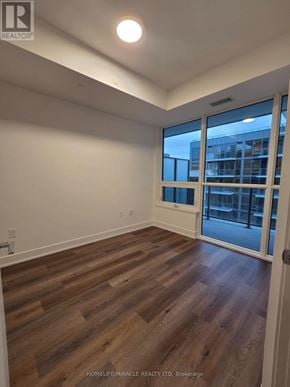Milton (Tm Timberlea) condo for rent - A room with wooden flooring and a sliding glass door.