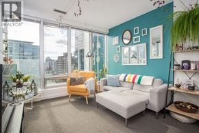 Vancouver apartment for rent - A living room with a yellow chair and a grey sofa.