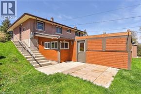 Cambridge apartment for rent - A house with a brown and orange exterior is for sale.