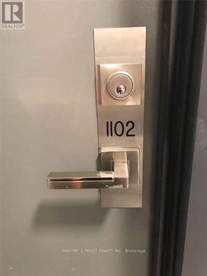 Toronto (Church-Yonge Corridor) condo for rent - A door handle with the number 1102 on it.
