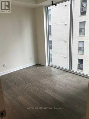 Toronto (Church-Yonge Corridor) condo for rent - A room with a sliding glass door leading to a balcony.