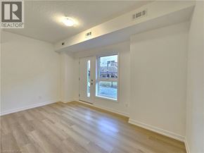 Waterdown townhouse for rent - A room with a window and a door is available for rent.