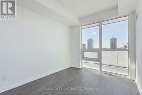 Toronto (Mount Pleasant West) condo for rent - A room with a view of the city through a large window.