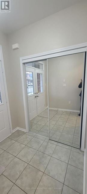 Brantford apartment for rent - A room with a white door and a mirror on the wall.