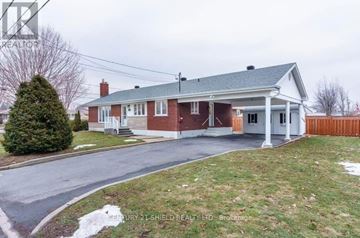 Cornwall apartment for rent - A house with a red brick exterior and a white porch.
