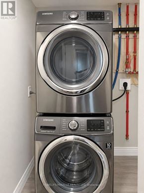 Brampton (Northwest Brampton) apartment for rent - A pair of Samsung front loading washing machines in a laundry room.