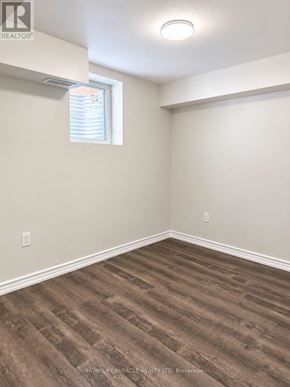 Brampton (Northwest Brampton) apartment for rent - A room with a window and wooden flooring.