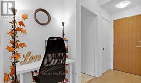 Toronto (Mimico) condo for rent - A room with a white desk, a black chair, and a wooden door.