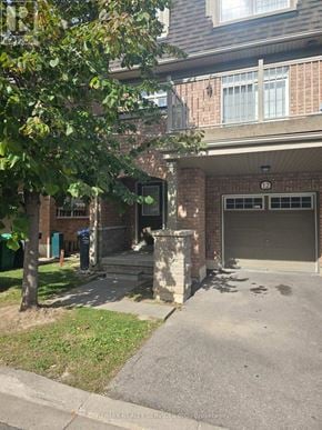 Brampton (Bram East) townhouse for rent - A tree is in front of a house.