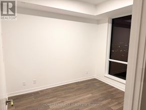 Vaughan (Beverley Glen) condo for rent - A room with a window and wooden flooring.