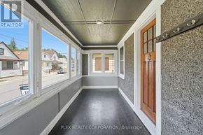 St. Catharines (Downtown) apartment for rent - A hallway with a view of the street outside the window.