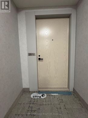 Vaughan (Vaughan Corporate Centre) condo for rent - A door with a 2012 sticker on it.