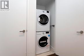 Mississauga (City Centre) condo for rent - A white washing machine and dryer in a small laundry room.