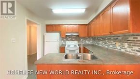 Aurora (Aurora Grove) townhouse for rent - A kitchen with orange cabinets and a sink.