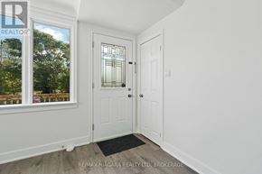 St. Catharines (E. Chester) apartment for rent - A white door with a glass window is in a room with white walls.