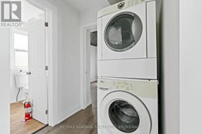 St. Catharines (E. Chester) apartment for rent - A white washing machine and dryer in a laundry room.