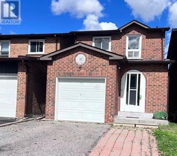 Markham (Milliken Mills East) apartment for rent - A red brick house with a white garage door and a white door.