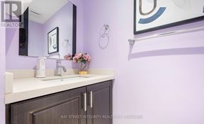 Markham (Milliken Mills East) apartment for rent - A bathroom with purple walls and a white countertop.