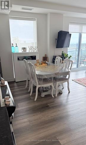 Vaughan condo for rent - A dining room with a table set for six people.