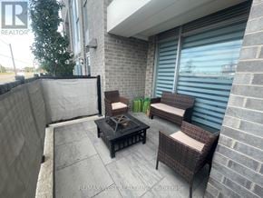 Hamilton (Riverdale) condo for rent - A patio with a table and chairs is shown.