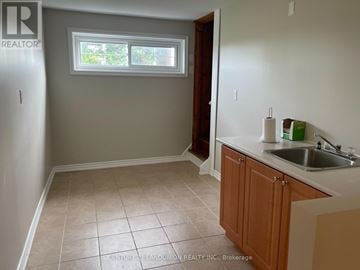 East Gwillimbury apartment for rent - A kitchen with a sink and a window.