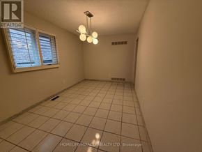 Mississauga (East Credit) apartment for rent - A room with a tiled floor and a window with blinds.