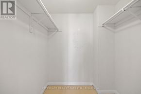 Toronto (Dovercourt-Wallace Emerson-Junction) townhouse for rent - A white room with a brokerage sign on the bottom.