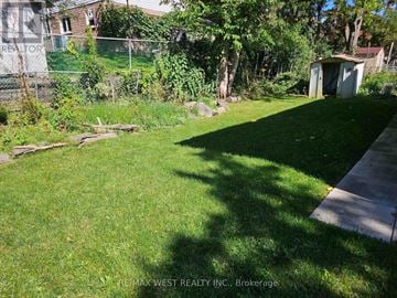 Toronto (Don Valley Village) apartment for rent - A backyard with a shed and a fence.