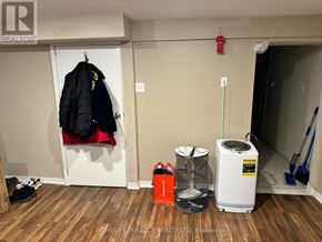 Mississauga (Mineola) apartment for rent - A room with a white wall and a black jacket hanging on a white door.