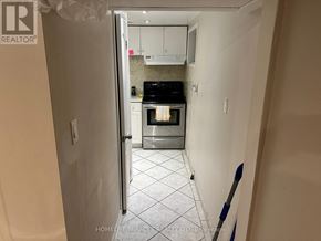 Mississauga (Mineola) apartment for rent - A kitchen with a refrigerator, oven, and microwave.