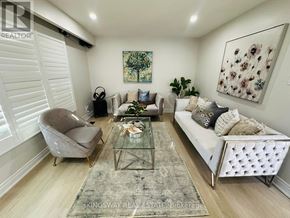 Kitchener apartment for rent - A living room with a couch, chair, and rug.