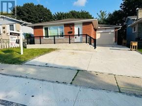 Kitchener apartment for rent - A house with a for sale sign in front of it.