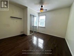 Oshawa (Central) apartment for rent - A room with a ceiling fan and wooden flooring.